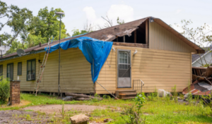 Residences in DeQuincy, Louisiana are still severely damaged and under construction almost a year after back-to-back Hurricanes Laura and Delta swept through the area in August and October. 