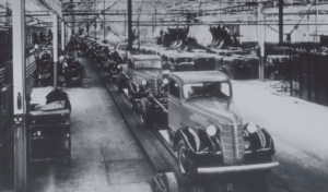 Trucks on a General Motors assembly line, circa the 1940s.