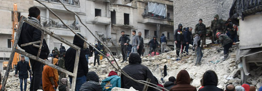 People standing on rubble after the earthquake. | Photo Courtesy of ACT Alliance.