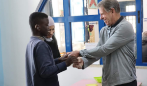 Ray Vandenberg with a student and teacher at the Holy Land Institute for the Deaf.