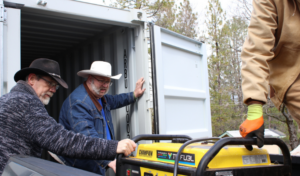 Jay, a member of the community dropping off a generator for the tool shed. Photo: Courtney Moore