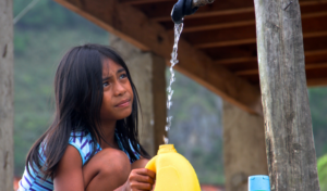 Girl at clean water well in the Philippines. 