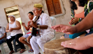 Father Orlando leading musical worship.