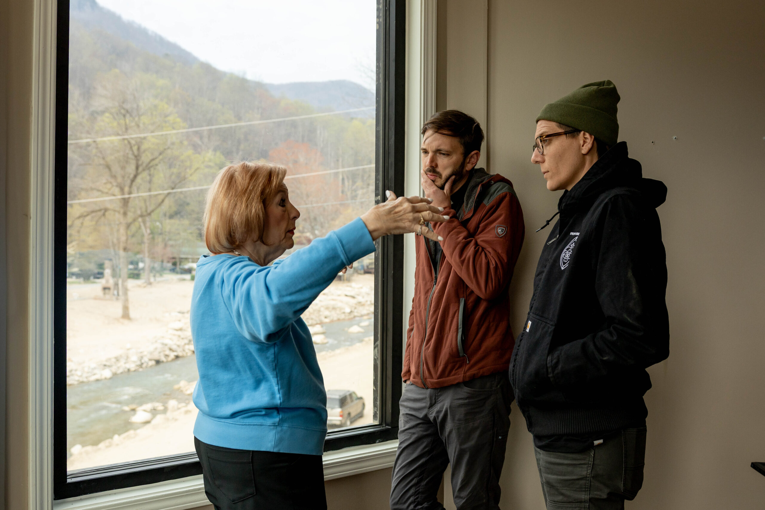 Linda (left) shares her experience with the Rev. John Roberts (center) and the Rev. Kelsey Davis (right).