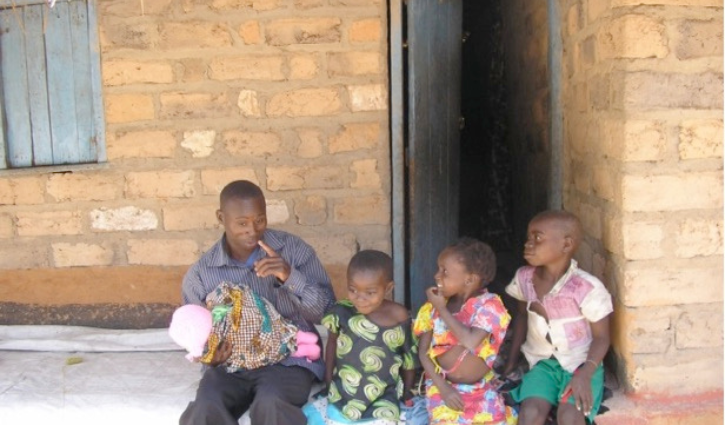 A father with his four daughters.