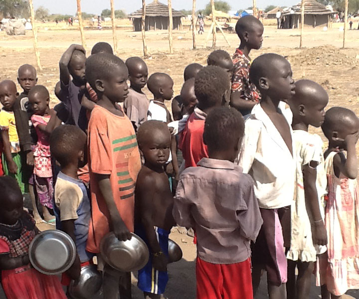 Children wait for cooked food in Awerial Camp, South Sudan