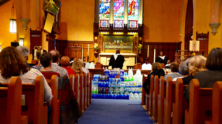 Flint church with water at altar.