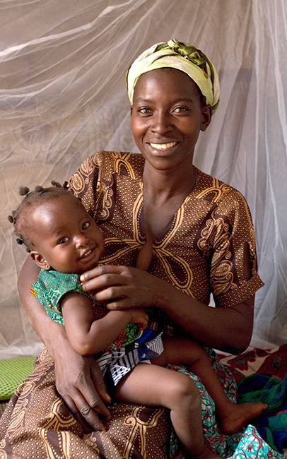 Ghanian woman with smiling child.