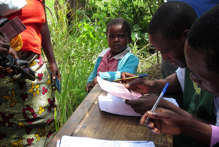 A child registering for the Zambia ECD program.