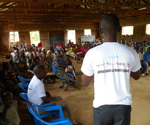 Malaria Control Agents speak to crowd at church in Maniema